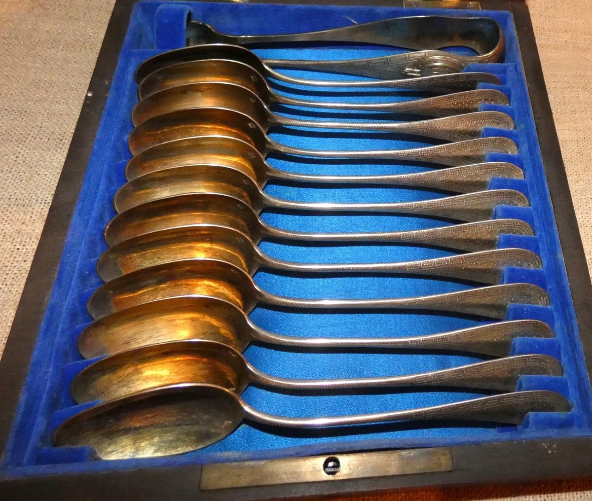 12 antique solid silver teaspoons and sugar tongs