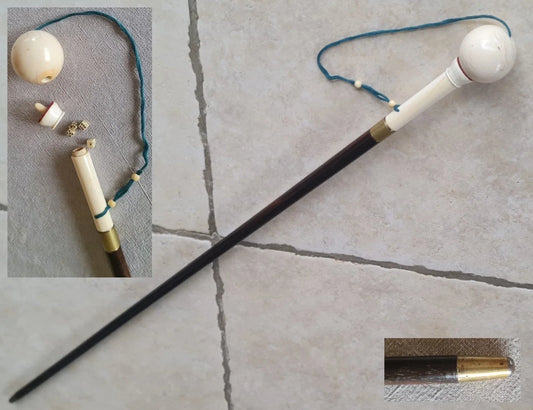 Cup-and-ball game cane