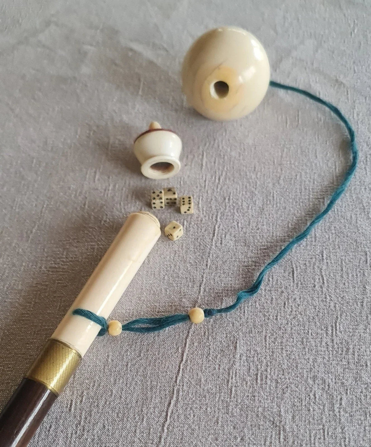 Cup-and-ball game cane