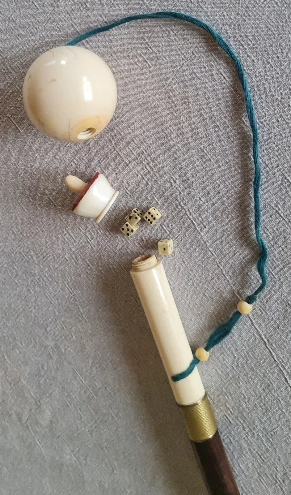 Cup-and-ball game cane