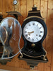 Antique wall clock with black and gold finishes