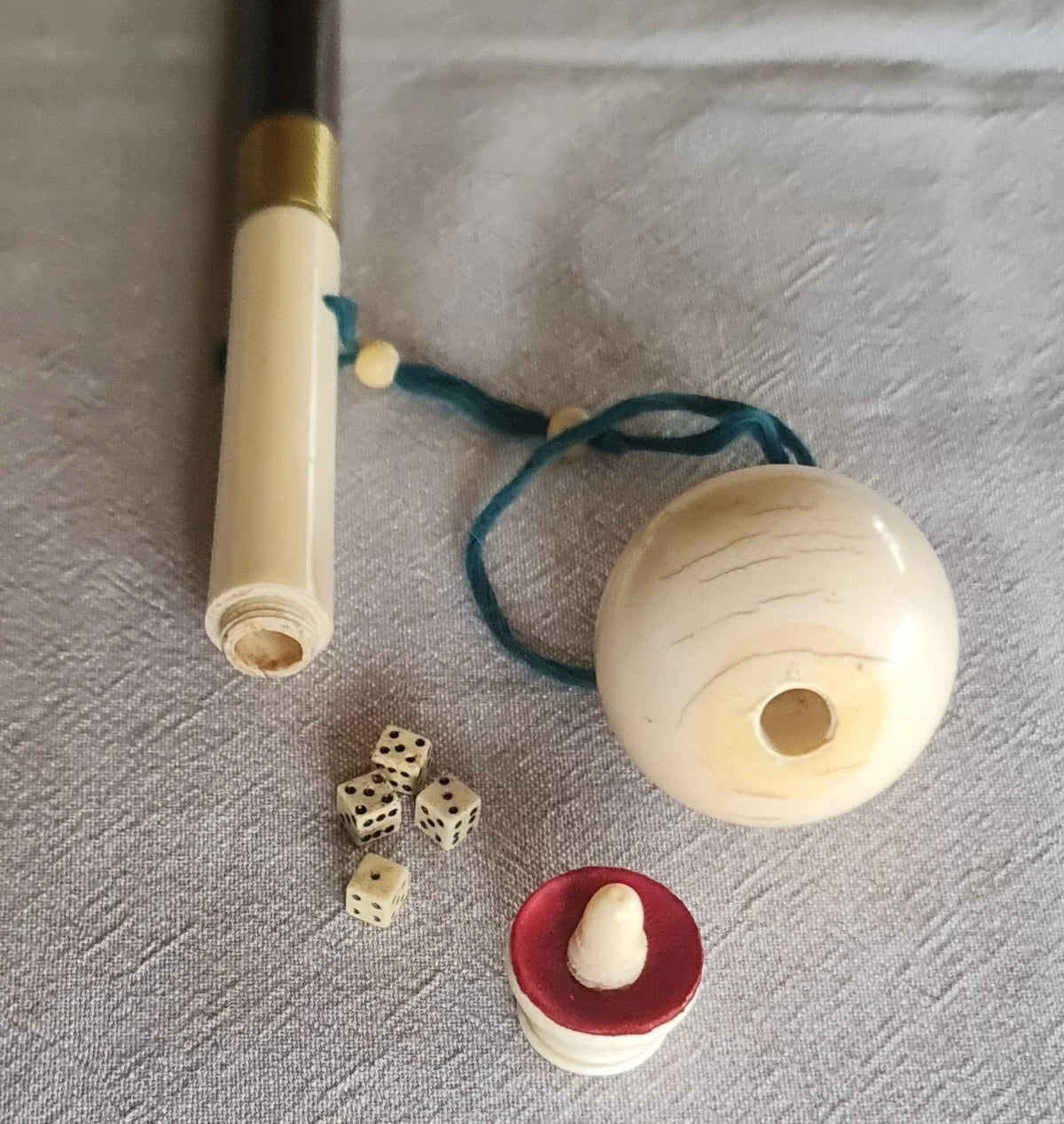 Cup-and-ball game cane