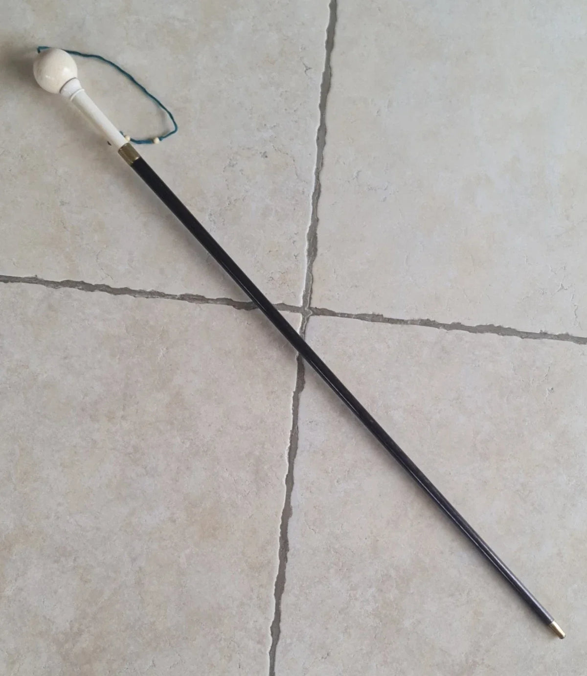Cup-and-ball game cane