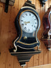 Antique wall clock with black and gold finishes