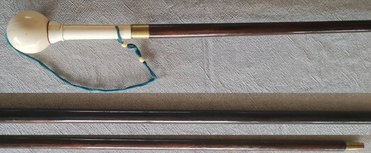 Cup-and-ball game cane