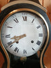 Antique wall clock with black and gold finishes
