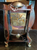 Antique wall clock with black and gold finishes