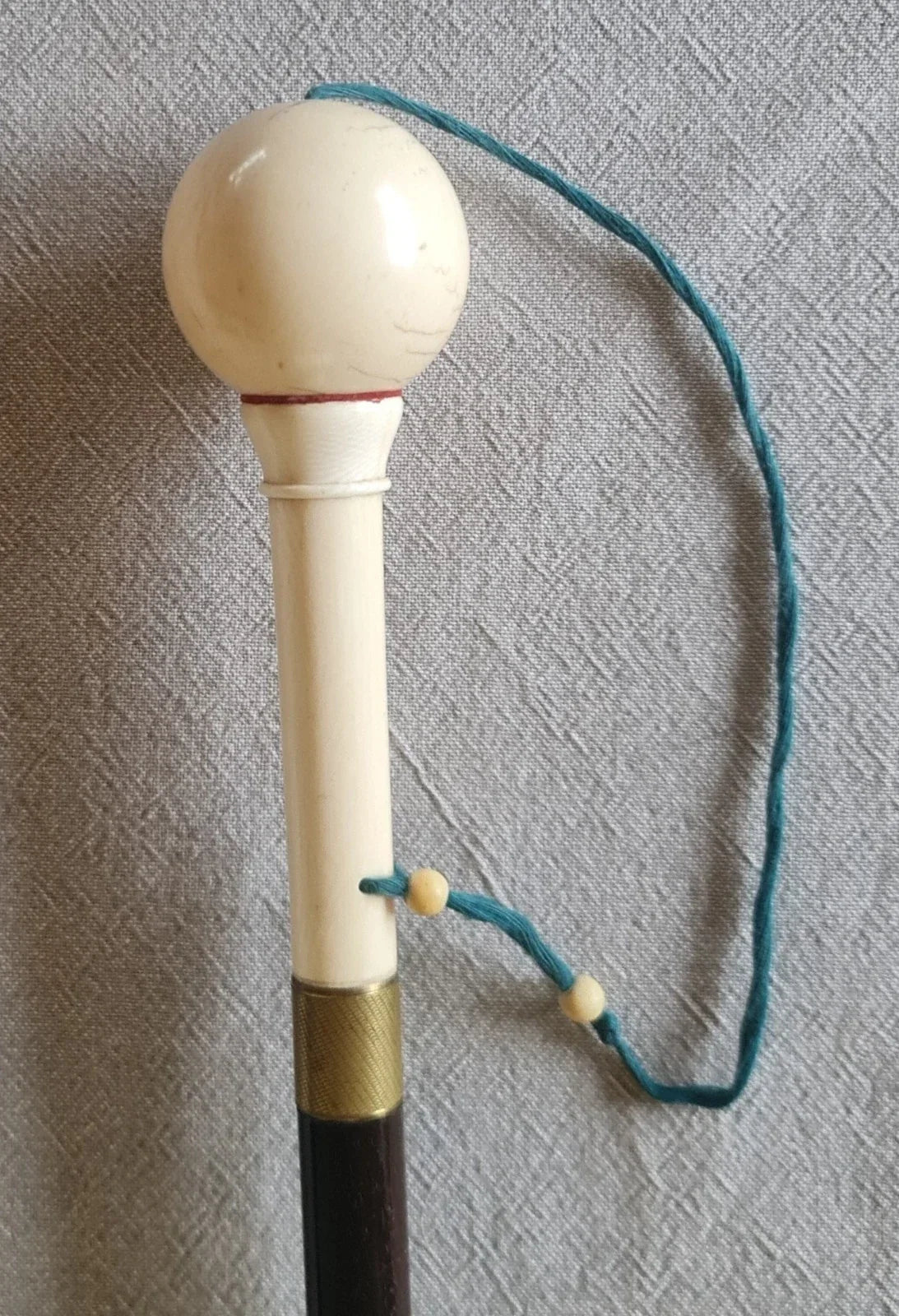 Cup-and-ball game cane
