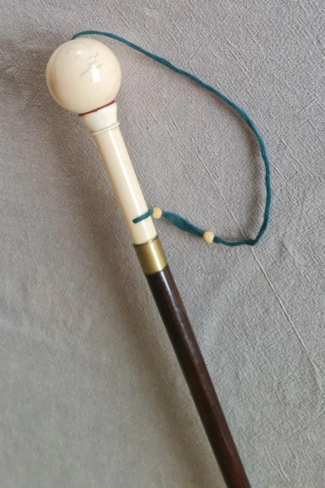 Cup-and-ball game cane