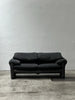 2-seater sofa with a sleek design by Enzo Magistretti for Cassina.
