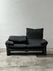 2-seater sofa with a sleek design by Enzo Magistretti for Cassina.