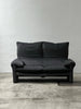 2-seater sofa with a sleek design by Enzo Magistretti for Cassina.