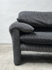 2-seater sofa with a sleek design by Enzo Magistretti for Cassina.