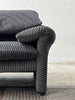 2-seater sofa with a sleek design by Enzo Magistretti for Cassina.