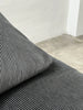 2-seater sofa with a sleek design by Enzo Magistretti for Cassina.
