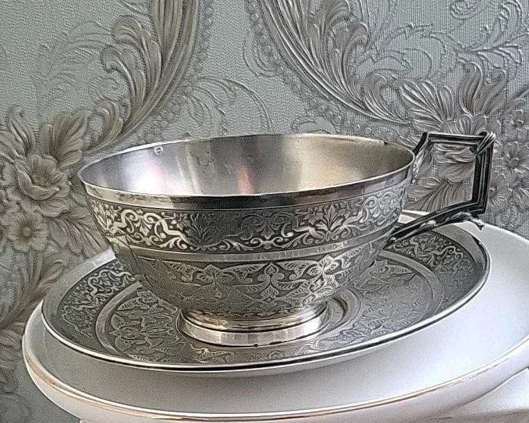Solid silver cup and saucer