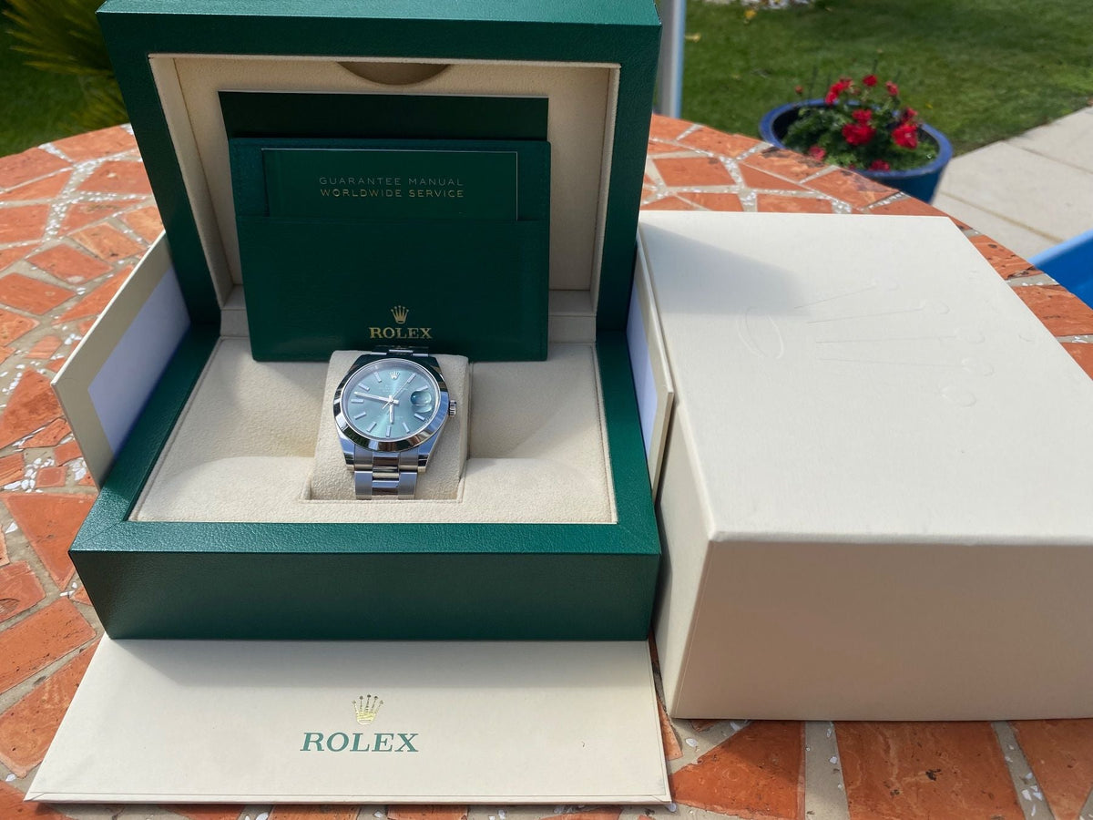 Rolex Datejust 41 luxury watch reference 126300 with prestigious green dial