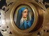 Large antique marbled bronze holy water stoup with a hand-painted porcelain Virgin Mary medallion, enameled stoup.