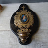 Large antique marbled bronze holy water stoup with a hand-painted porcelain Virgin Mary medallion, enameled stoup.