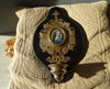 Large antique marbled bronze holy water stoup with a hand-painted porcelain Virgin Mary medallion, enameled stoup.