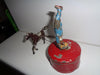 Mechanical circus toy depicting a clown balancing on its hands