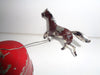Mechanical circus toy depicting a clown balancing on its hands
