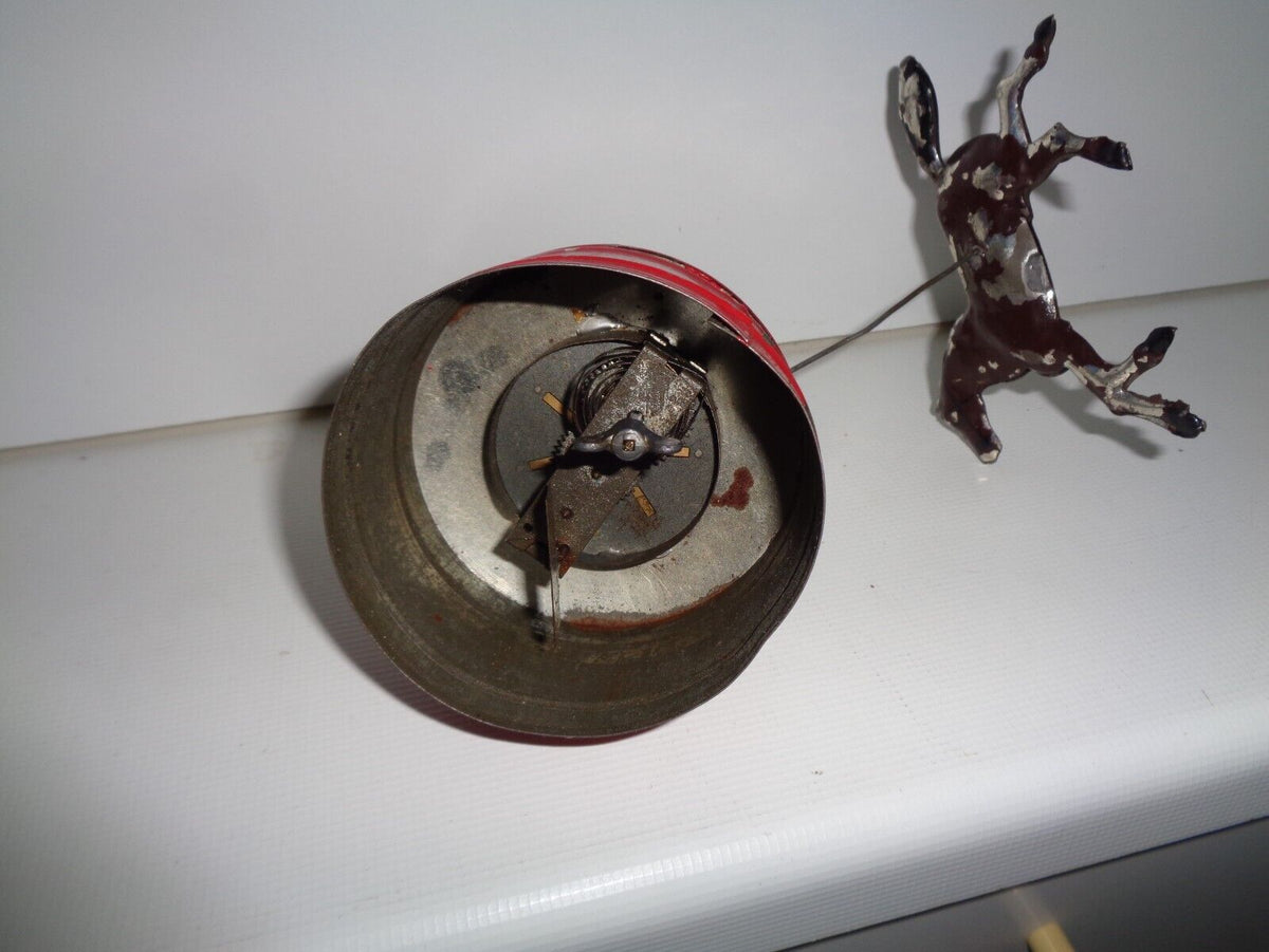 Mechanical circus toy depicting a clown balancing on its hands