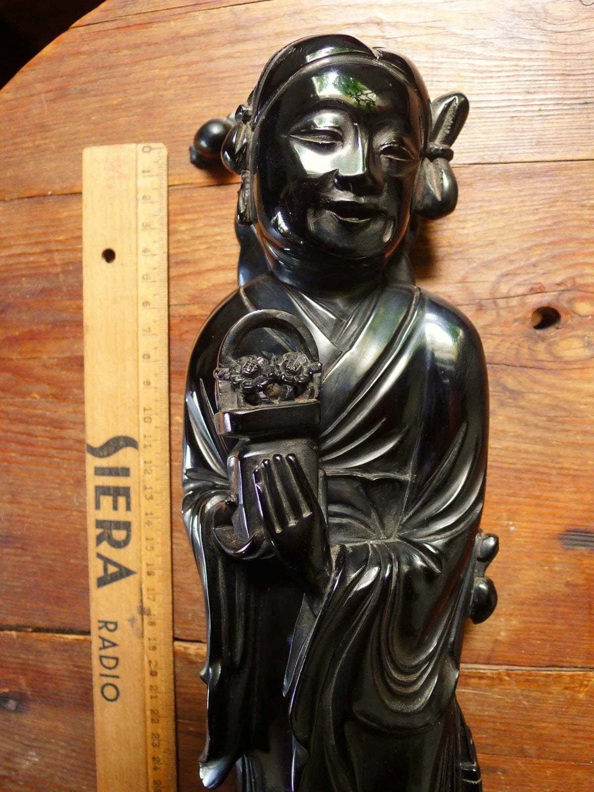 Antique cherry red bakelite statue from the early to mid-20th century