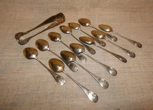 12 antique solid silver teaspoons and sugar tongs