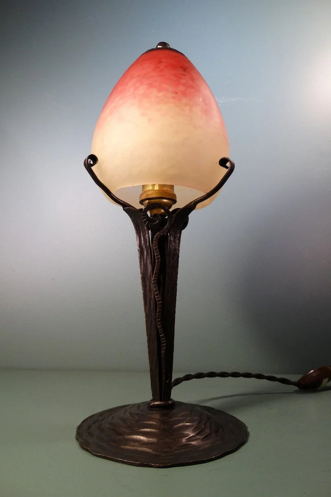 Wrought iron lamp with pâte de verre tulip shade. Signed Schneider.