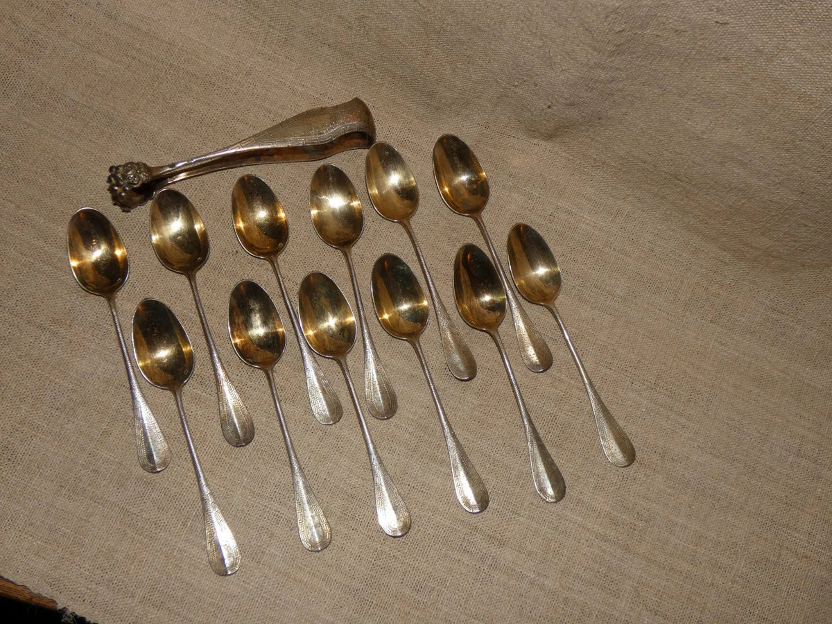 12 antique solid silver teaspoons and sugar tongs