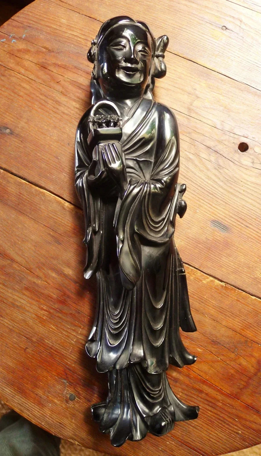 Antique cherry red bakelite statue from the early to mid-20th century