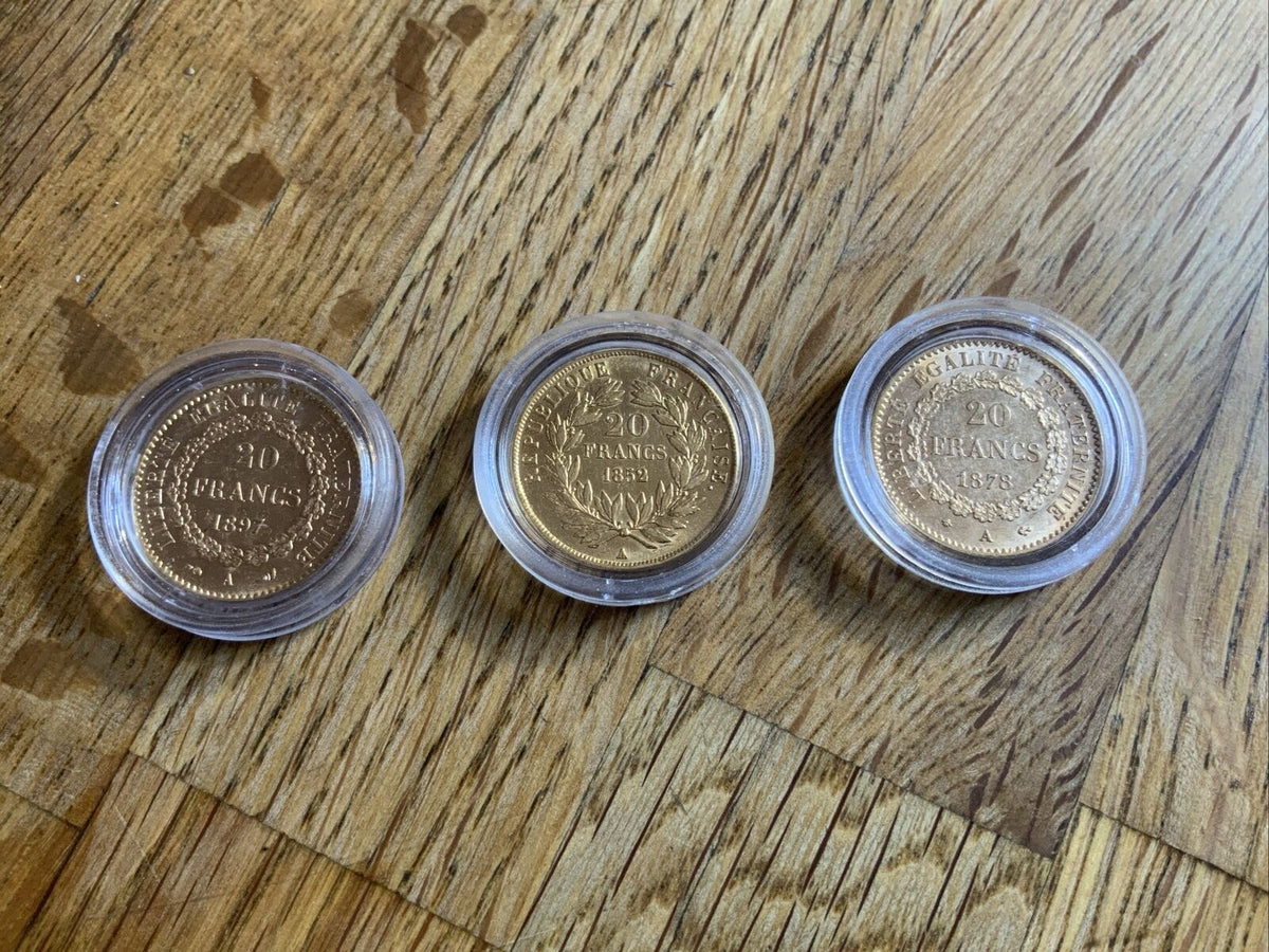 Set of 3 gold 20 francs Napoleon coins.