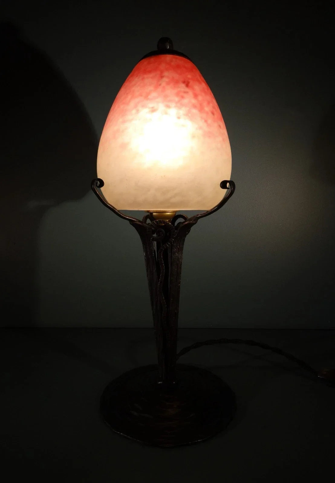 Wrought iron lamp with pâte de verre tulip shade. Signed Schneider.