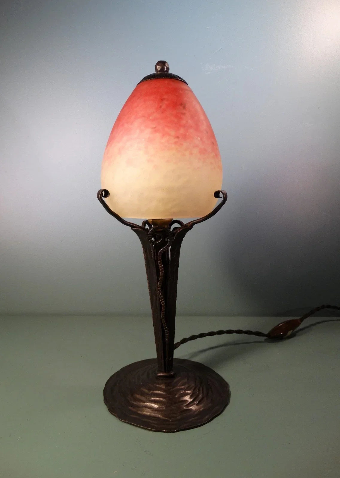 Wrought iron lamp with pâte de verre tulip shade. Signed Schneider.
