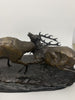 Bronze sculpture of stags fighting